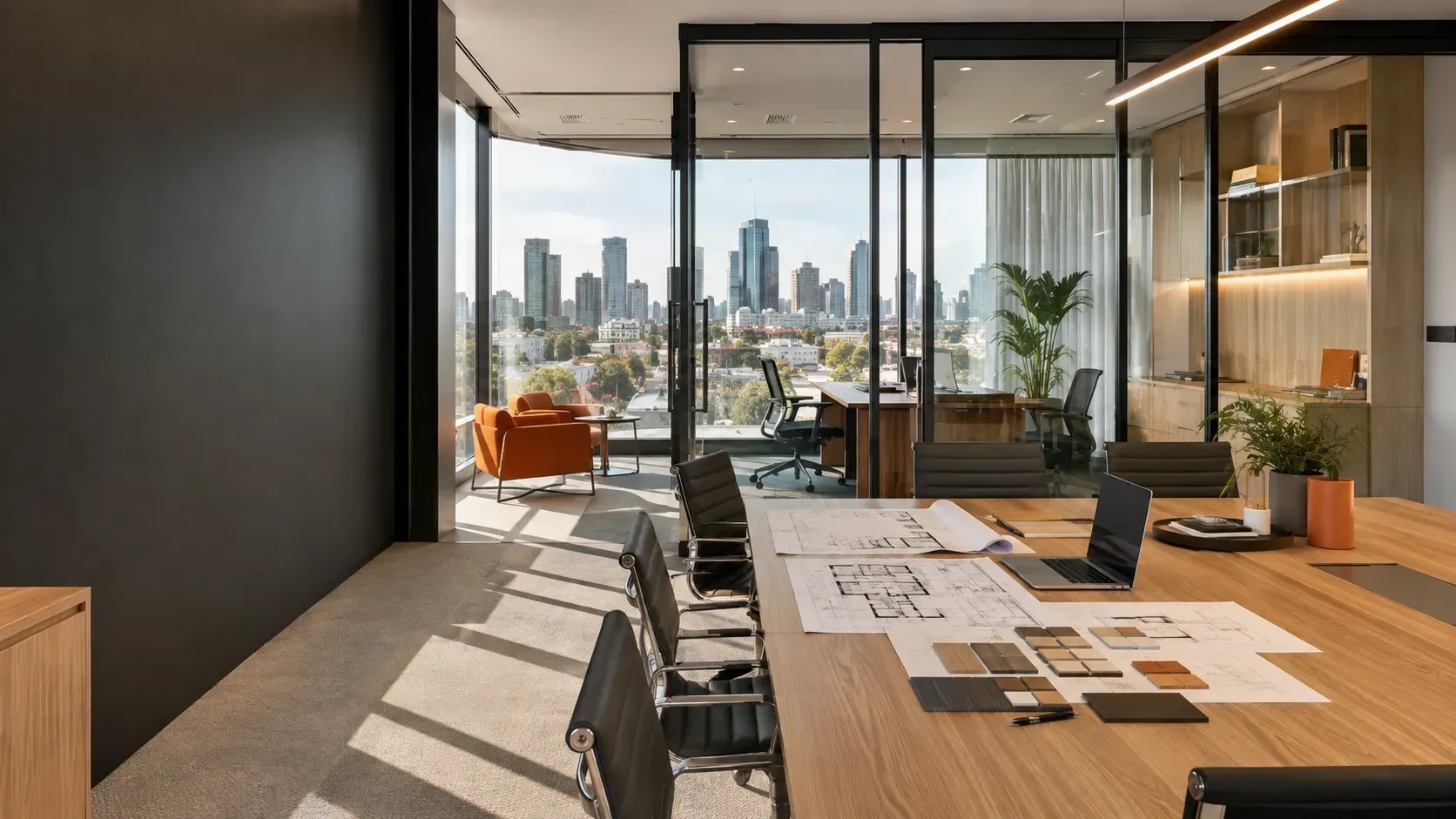 Modern Melbourne commercial office fitout with a meeting room, timber table, glass partitions, ergonomic chairs, and city skyline views